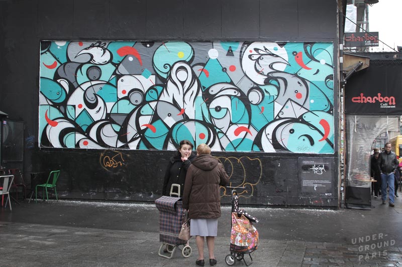 Hazul Luzah from Porto paints at Le M.U.R., a public art project in NE Paris neighbourhood, Oberkampf. photo for Underground Paris
