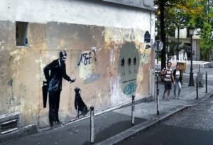 Banksy stencil Paris La Sorbonne 1968 capitalism underground Paris 095531-Ruby Comet-2018.jpg